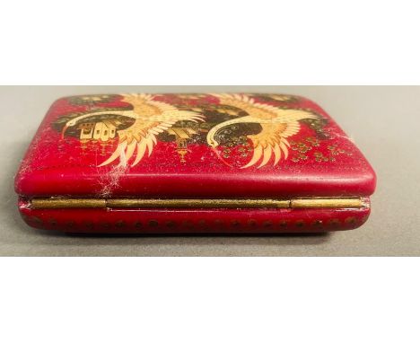 An ornate Russian snuff box in red