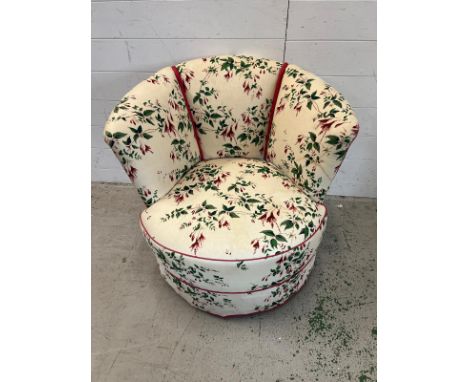 A vintage club chair with floral upholstery 