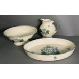 Three pieces of Poole Pottery to include bowl, jug and dish