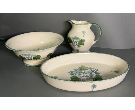 Three pieces of Poole Pottery to include bowl, jug and dish 