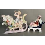 Two German fine porcelain figures of a cherub on a sleigh and a reclining lady playing an instrument