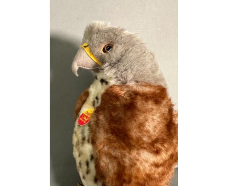 A Steiff eagle cuddly toy with button to tail plumage 
