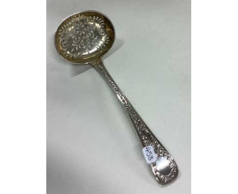 EXETER: A rare chased silver sifter ladle embossed with flowers. 1854. By Edwin Sweet. Approx. 64 grams. Est. £80 - £120.