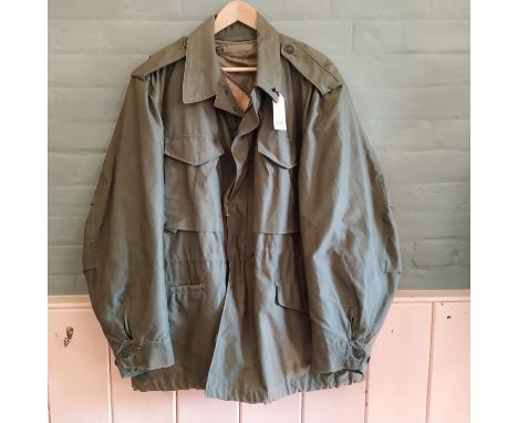 A U.S.A. Army model 1951 field jacket complete with liner, Large size, dated 1957
