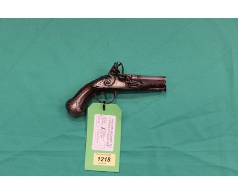 A continental Flintlock pocket pistol, approx 7" overall with a 3 1/4" barrel, two stage lock working well, with white metal 