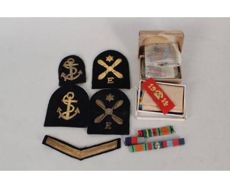 A boxed WWI pair to R.352 G.R.Thirtle A.B. R.N.V.R. with '1914 cloth' plus WWII group of four including Pacific Star with Bur