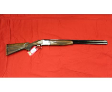 A 12 bore Magnum O/U shotgun by Laurona with 28" barrels, four chokes included and in overall very good condition, bores exce