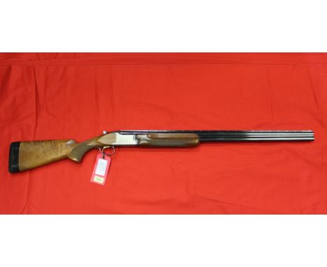 A 12 bore O/U multi-choke shotgun by Miroku with 32" barrels, single trigger and selective safety, complete with cased set of