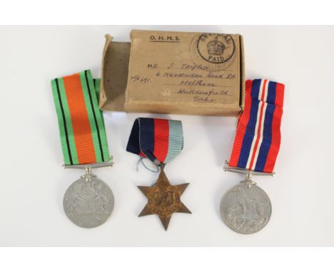 A boxed WWII group of three with slip including 39/45 Star (Army issue)
