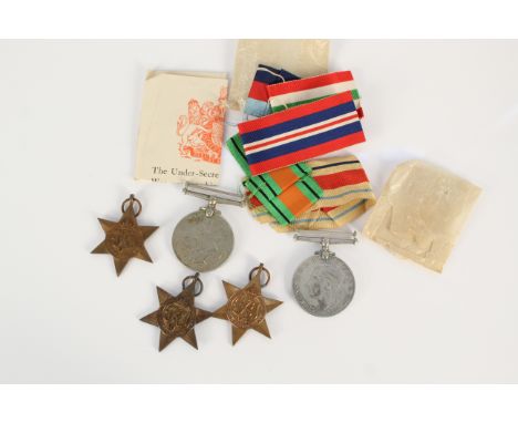 A boxed WWII group of five with slip including 39/45 Star, Italy Star and Africa Star (Army issue)