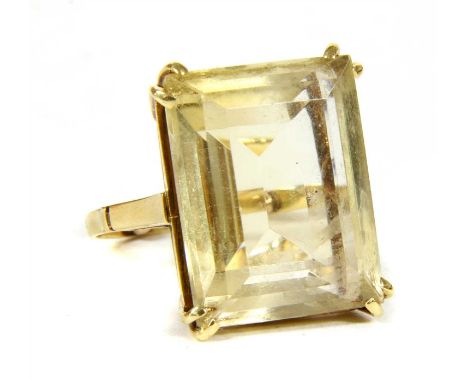 A gold single stone citrine ring, an emerald cut citrine, 29.7 x 15.5 x 8.6mm in size, double claw set to open tapered should