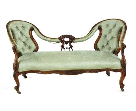 A Victorian walnut serpentine fronted chair back settee , with carved frame, 160cm wide, 80cm deep, 80cm high