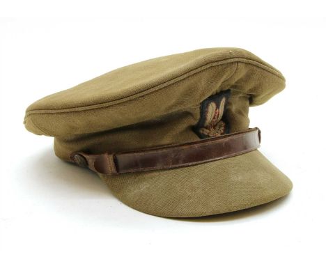 A WWII British army officers named forage cap, with LT Thomas penned inside with unit name scratched out. SAS (special air se