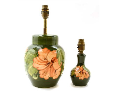 A Moorcroft table lamp , in the hibiscus pattern, 33cm high, together with another smaller (2)