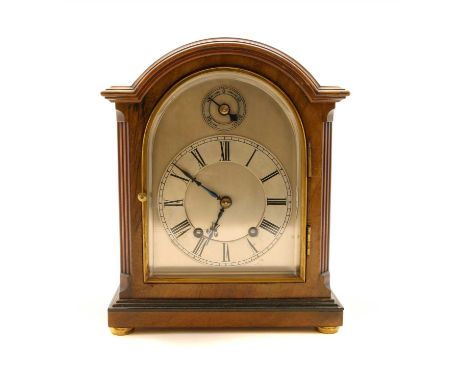 An eight day mahogany cased mantel clock, by Penlington and Batty, Liverpool, the silvered arched dial with Roman .