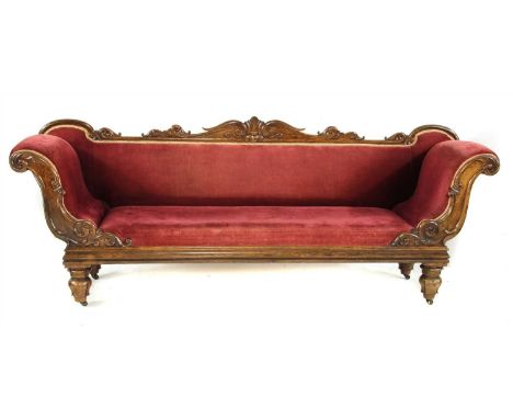 A Regency simulated rosewood settee , the scrolling frame with carved foliate decoration, upholstered with red corduroy and o