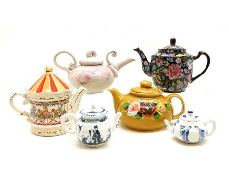 A collection of 27 decorative teapots, to include reproductions from V&amp;A, 'bow' 'Worcester' etc.