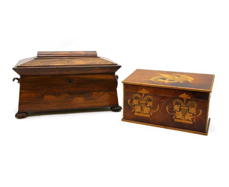 A Regency rosewood sarcophagus shaped tea caddy, with two lidded compartments, lacking mixing bowl, ring handle and escutcheo