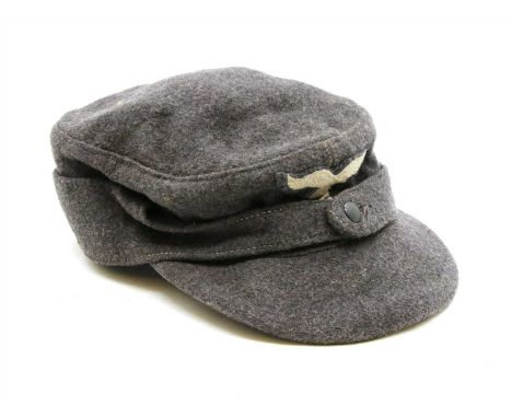 An original M43 1944 dated German Luftwaffe service cap, with Eagle and Swastika patch and clear visible makers stamp inside 