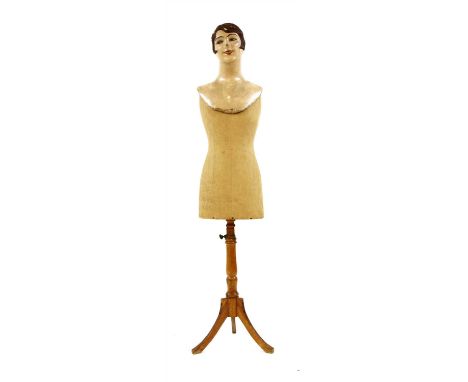 A vintage tailor's dummy , with 1930s mask we sat on top for fun