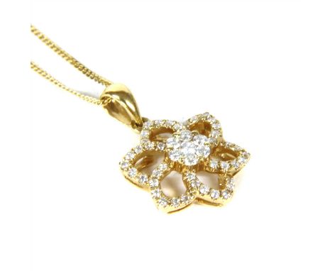 An 18ct gold diamond floral cluster pendant, with a central 1/6 cluster of claw set brilliant cut diamonds, to openwork overl