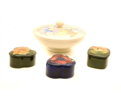 A Moorcroft lidded dish together with three smaller lidded trinket boxes (4)