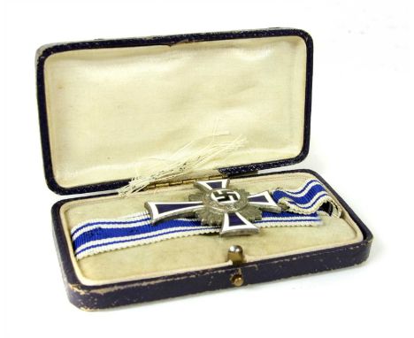 Germany (1933-1945) Honor Cross of the German Mother, having a blue and white enamel cross with central black enamel stationa