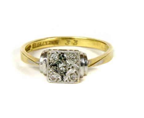 An Art Deco five stone diamond ring, with eight cut diamonds grain set into a square plaque head, to stepped white shoulders 