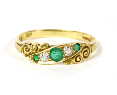 An 18ct gold emerald and diamond five stone ring, with a graduated row of alternating round mixed cut emeralds and Swiss cut 