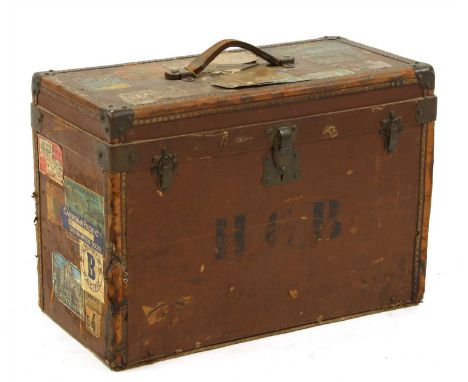 A vintage leather and metal mounted travelling box, the hinged rectangular top and drop front with divisioned interiors, the 