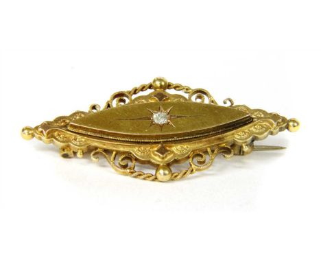 A Victorian gold diamond brooch, with an old eight cut diamond star set to the centre of a raised marquise shaped boss, to ap