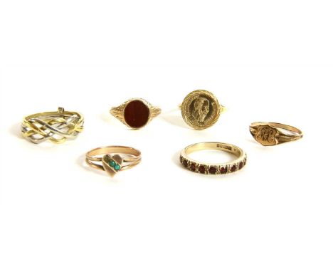 Six assorted rings, to include a two colour four row puzzle ring, tested as approximately 18ct gold, finger size O, a 9ct gol