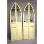 A PAIR OF WHITE GARDEN MIRRORS. 6ft high x 1ft 10ins wide.