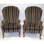 A GOOD PAIR OF WING ARMCHAIRS, striped fabric, on cabriole legs.