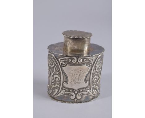 A VICTORIAN SILVER OVAL TEA CADDY with repousse decoration. London 1895.