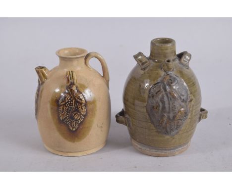 A CHINESE GLAZED POTTERY PAIRING VESSEL, 12.5cm high; together with another (2).