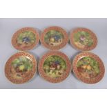A SET OF SIX PORCELAIN FRUIT PLATES. 10.5ins diameter.