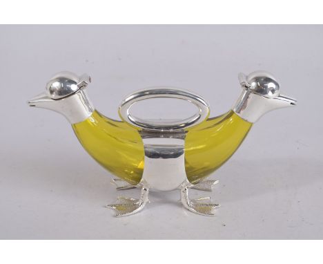 AN AMBER GLASS NOVELTY DECANTER with duck head. 10ins high.