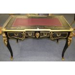 A GOOD BOULLE BUREAU PLAT with leather top, three frieze drawers, ormolu mounts and masks, on
