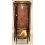 A LOUIS XVI STYLE BOWFRONTED VITRINE with three-quarter glass door and sides, over painted landscape