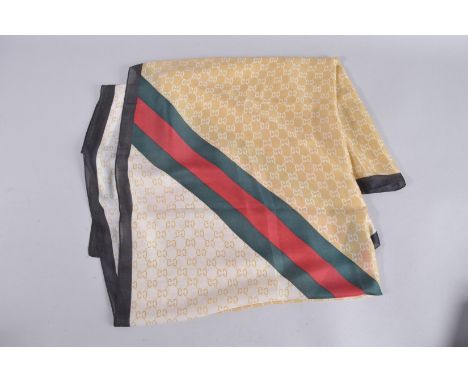 A GUCCI SILK SCARF. 36ins x 36ins, in a Gucci box.