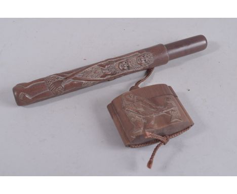 A JAPANESE HARDWOOD INRO AND PIPE CLEANER.