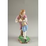 A GOOD HOCHST PORCELAIN FIGURE OF A YOUNG MAN. Circle mark in blue. 17cms high.