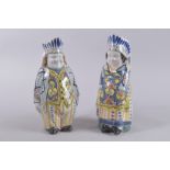 A GOOD PAIR OF POLYCHROME FIGURE JUGS. 11.5ins high.