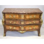 A LARGE 18TH CENTURY LOUIS XVI BOMBE FRONTED COMMODE with thick marble top, three long drawers