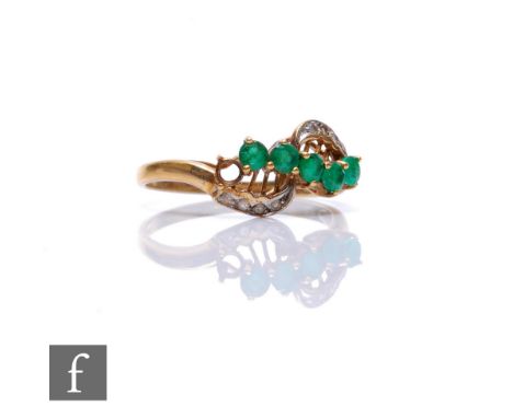 A 9ct hallmarked emerald and diamond ring, five emeralds and eight diamonds to a slight twist, weight 2g, ring size R. 