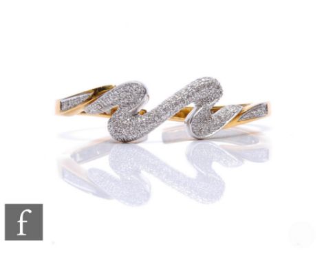 An 18ct hallmarked diamond bangle, pave set stones to a wave design to a double spring hinged plan bangle, weight 31.5g, inte