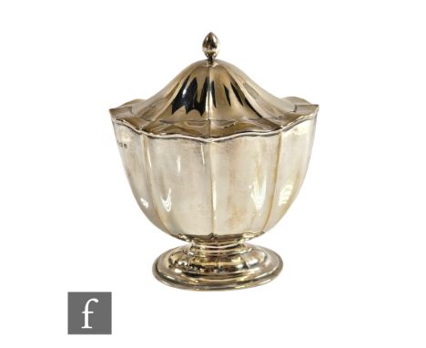 A hallmarked silver pedestal tea caddy with fluted decoration above on oval foot, weight 6oz, height 15cm, Birmingham 1905,&n