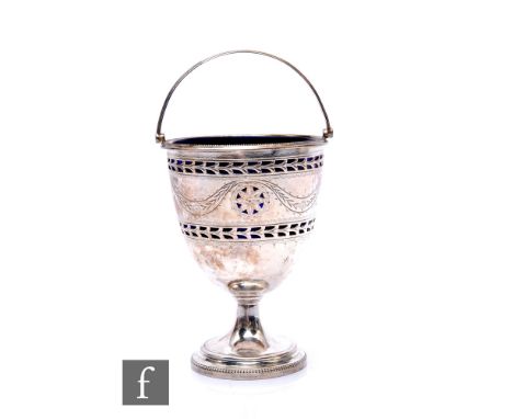 A hallmarked silver pedestal sugar basin with engraved swag and pierced decoration encompassing blue glass line, height 12cm,