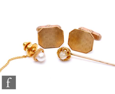 A pair of 9ct hallmarked canted rectangular swivel cufflinks, weight 7.5g, with a pearl set tie stud and stick pin. (3) 